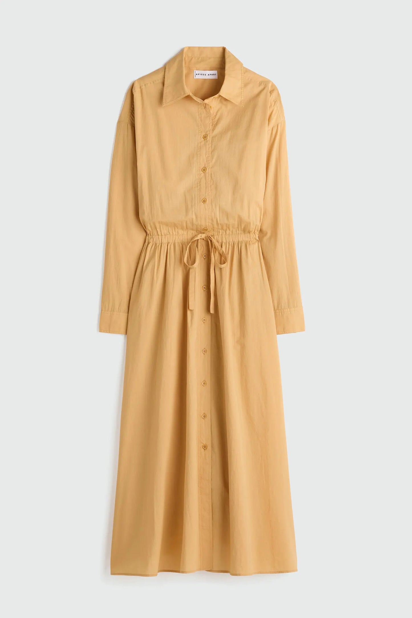 Yellow dress with a belt on a light gray background