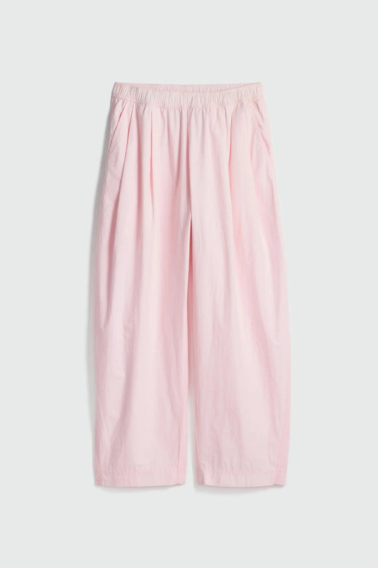 Pink wide-leg pants on a light gray background