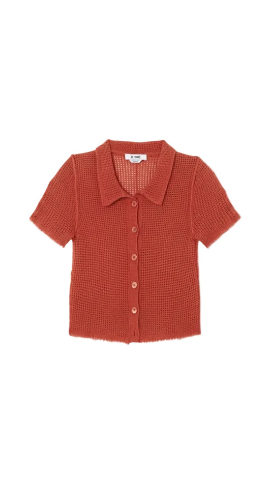 Red textured shirt on a light gray background
