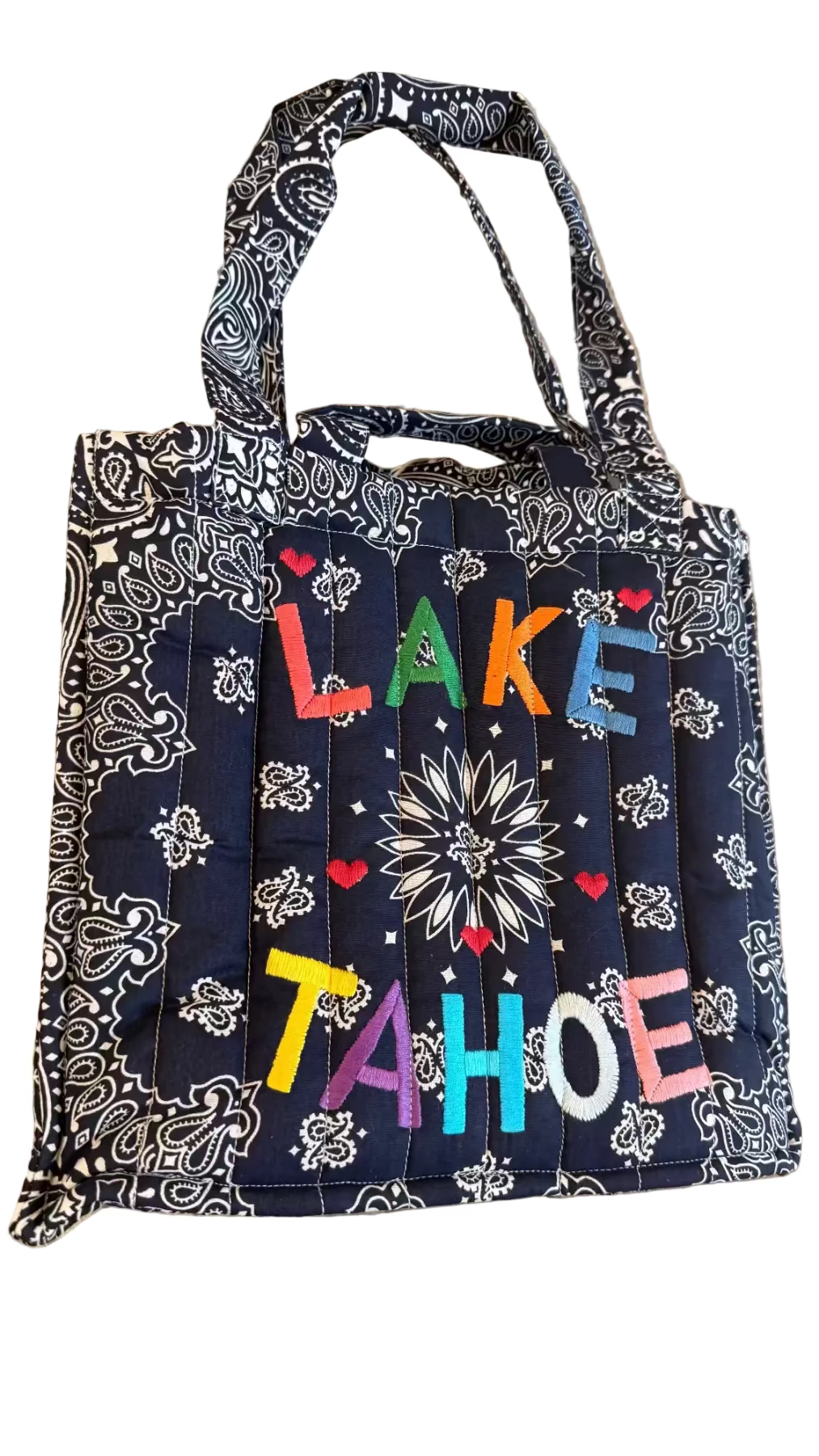Tote bag with 'Lake Tahoe' text on a textured surface
