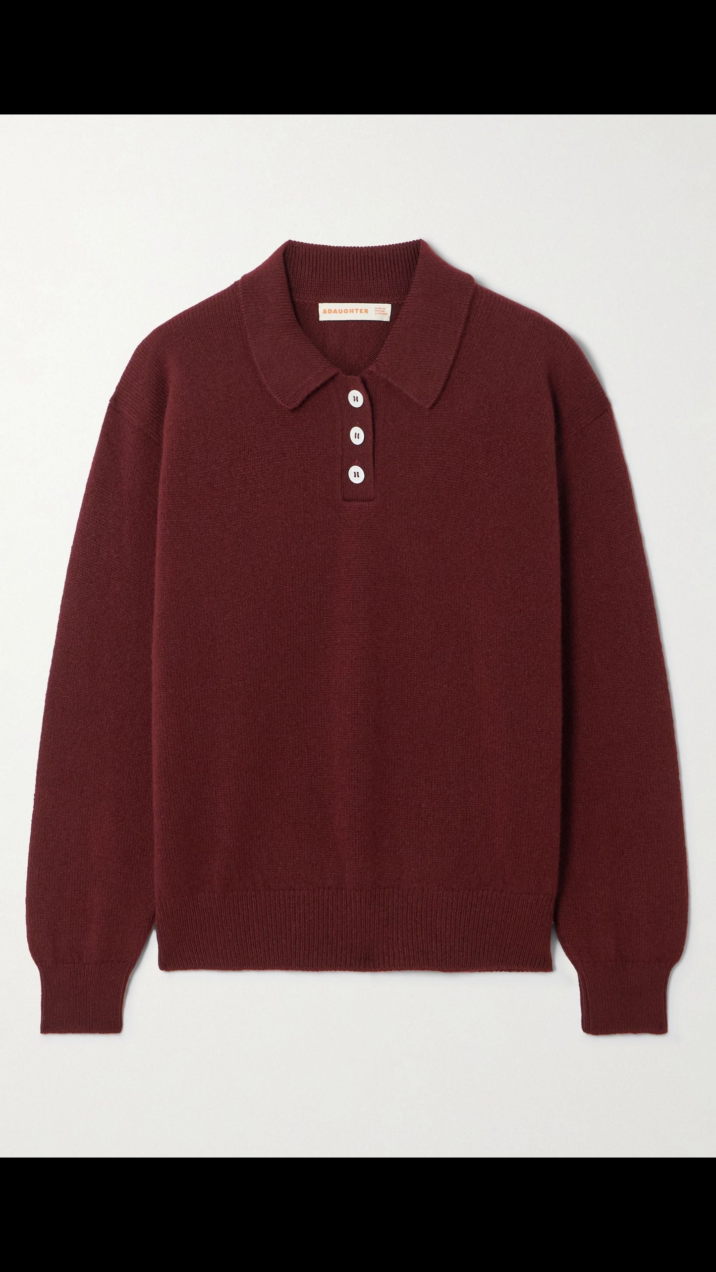 Maroon sweater with a collar on a light gray background