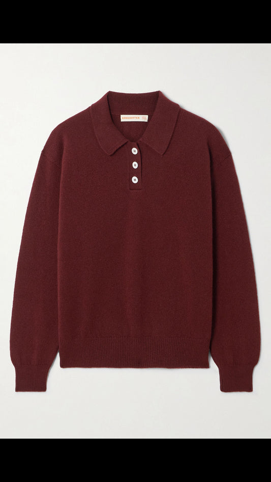 Maroon sweater with a collar on a light gray background
